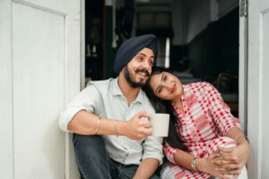 pexels photo 4307719 4307719 Happy Indian couple relaxing at home with coffee, embracing love and leisure. Perfect for lifestyle and relationship themes.